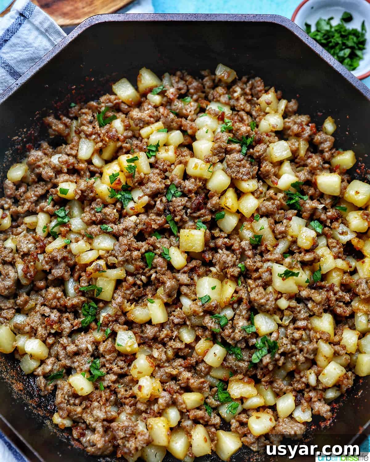 Breakfast Sausage and Potato Hash Recipe 2 Breakfast sausage potato hash served in a skillet