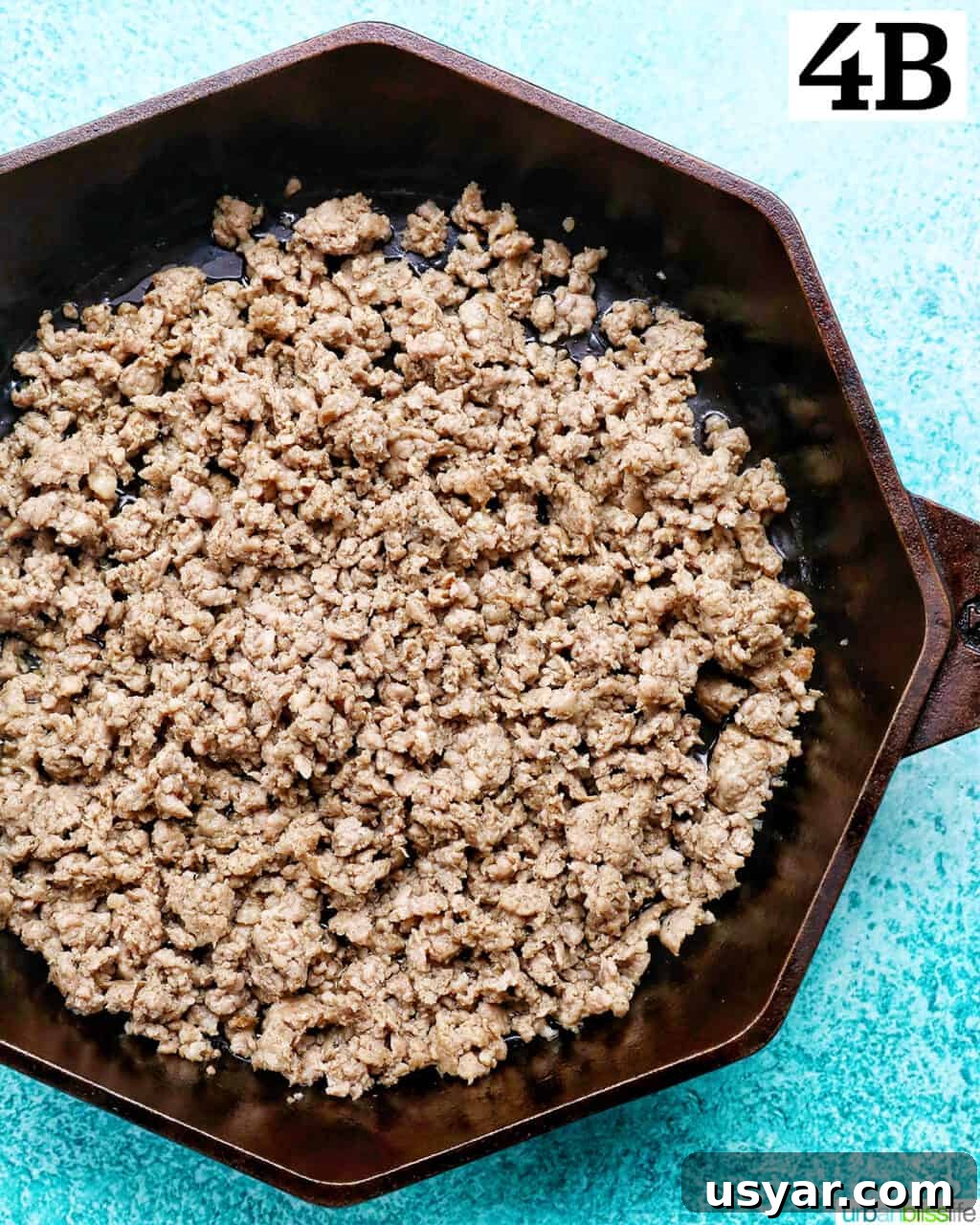 Breakfast Sausage and Potato Hash Recipe 12 Breaking up sausage while cooking