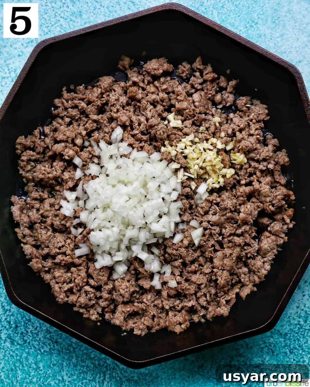 Breakfast Sausage and Potato Hash Recipe 13 Adding onion and garlic to sausage