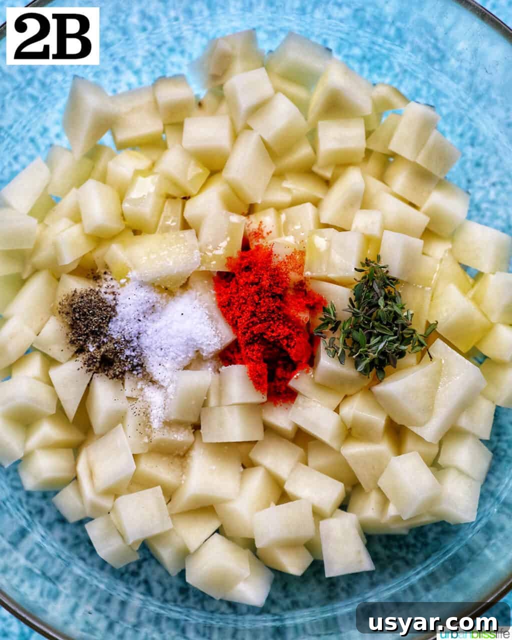 Breakfast Sausage and Potato Hash Recipe 8 Adding spices to potatoes