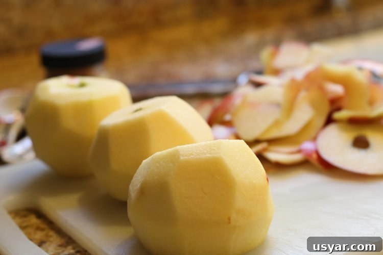 Cinnamon Apple Puff Pastry Bites 3 peeled apples on chopping board