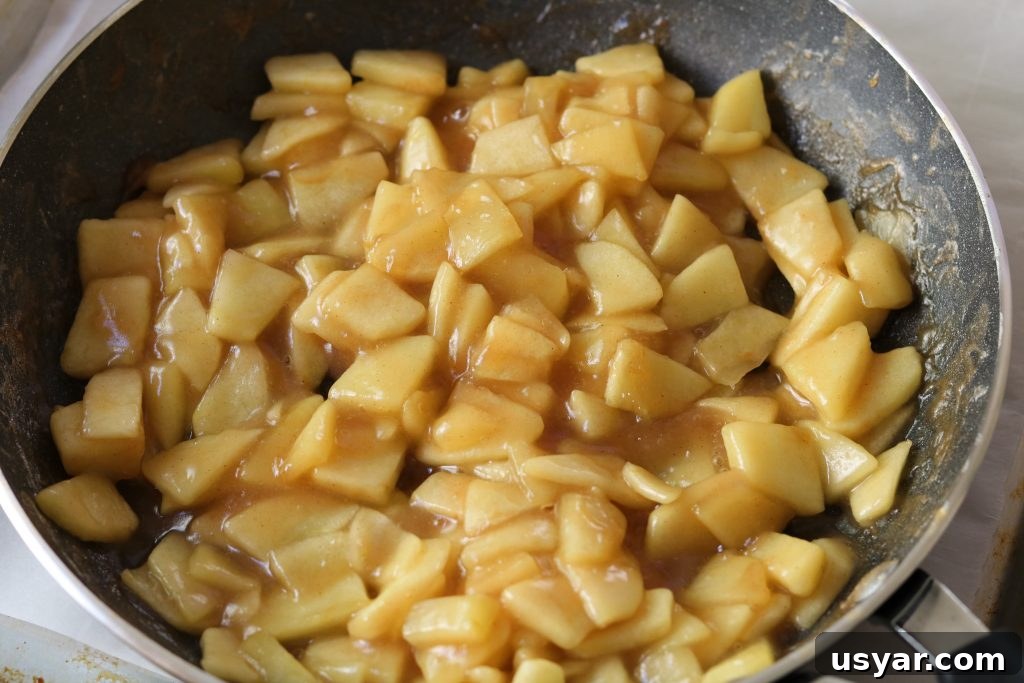 Cinnamon Apple Puff Pastry Bites 4 cooked apples in pan