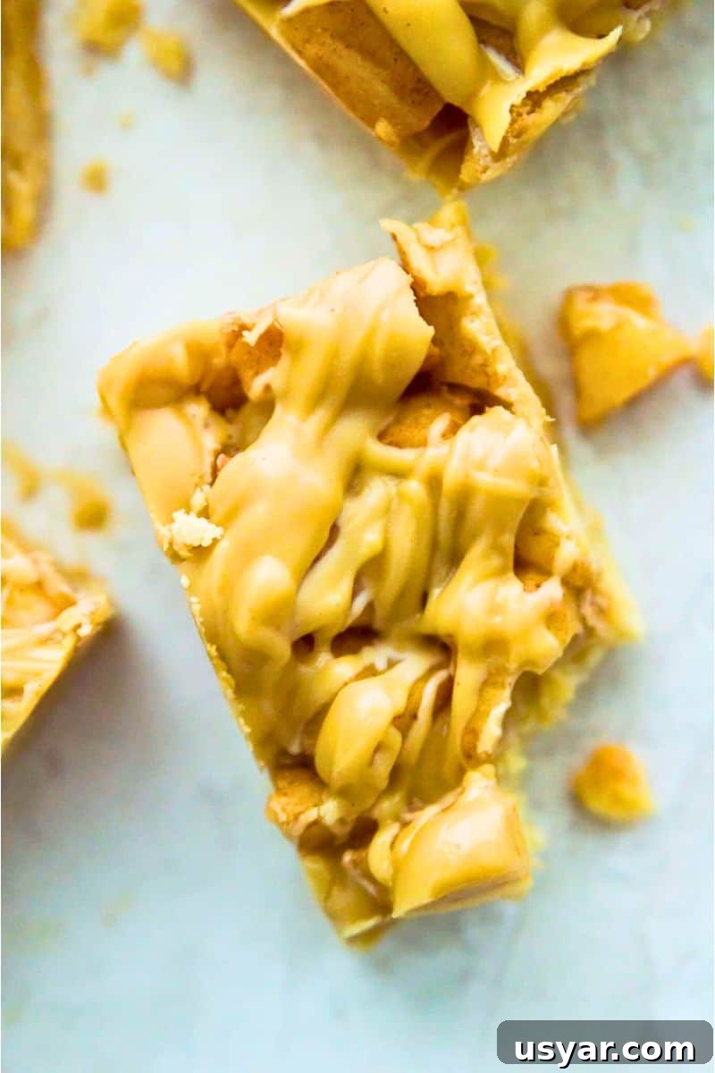Gluten-Free Vegan and Paleo Apple Pie Bars 2 A caramel apple pie bar with a bite taken out of it.
