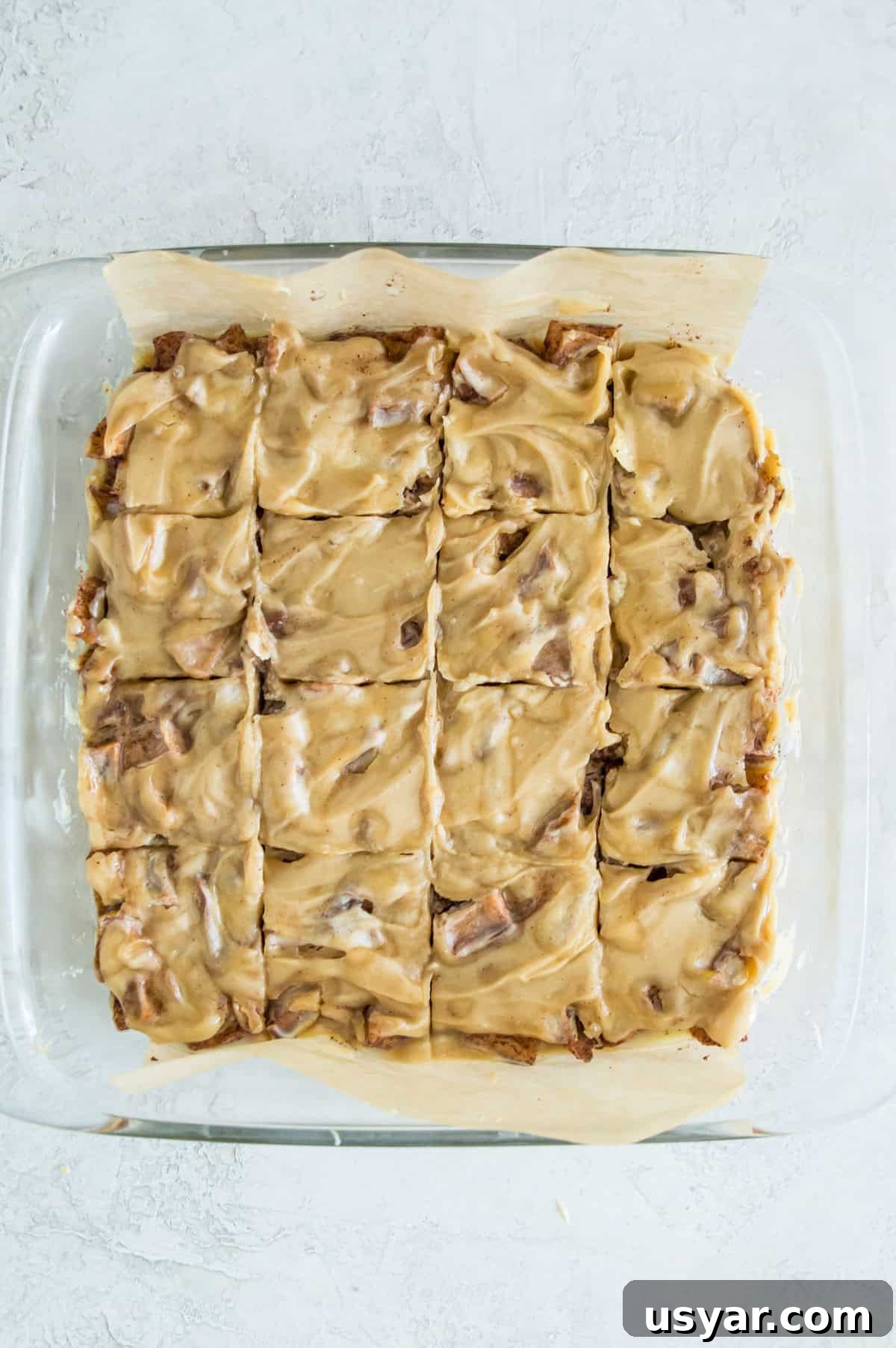 Gluten-Free Vegan and Paleo Apple Pie Bars 11 A square baking pan with caramel apple bars in it cut into squares.