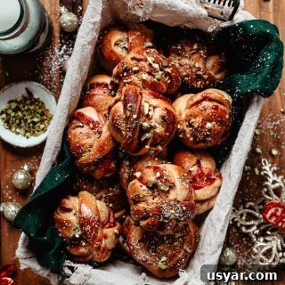 Cinnamon rolls with lingonberry and pistachios