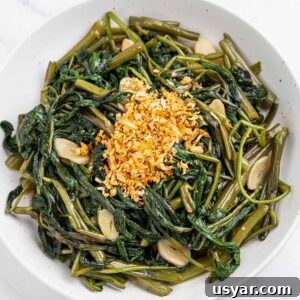 Rau muong water spinach with garlic on a plate.