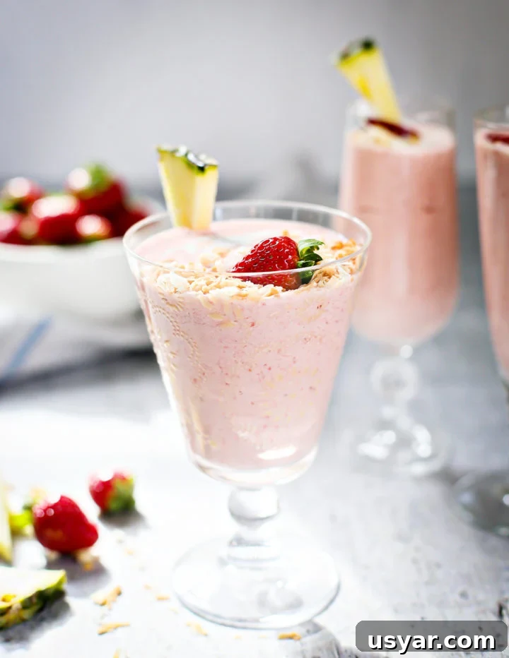 strawberry pineapple smoothie photo of Strawberry Pineapple Smoothie in a glass