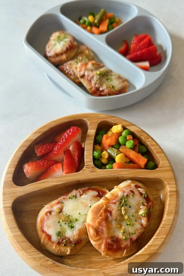 Air fryer naan pizzas served with strawberries and mixed vegetables.