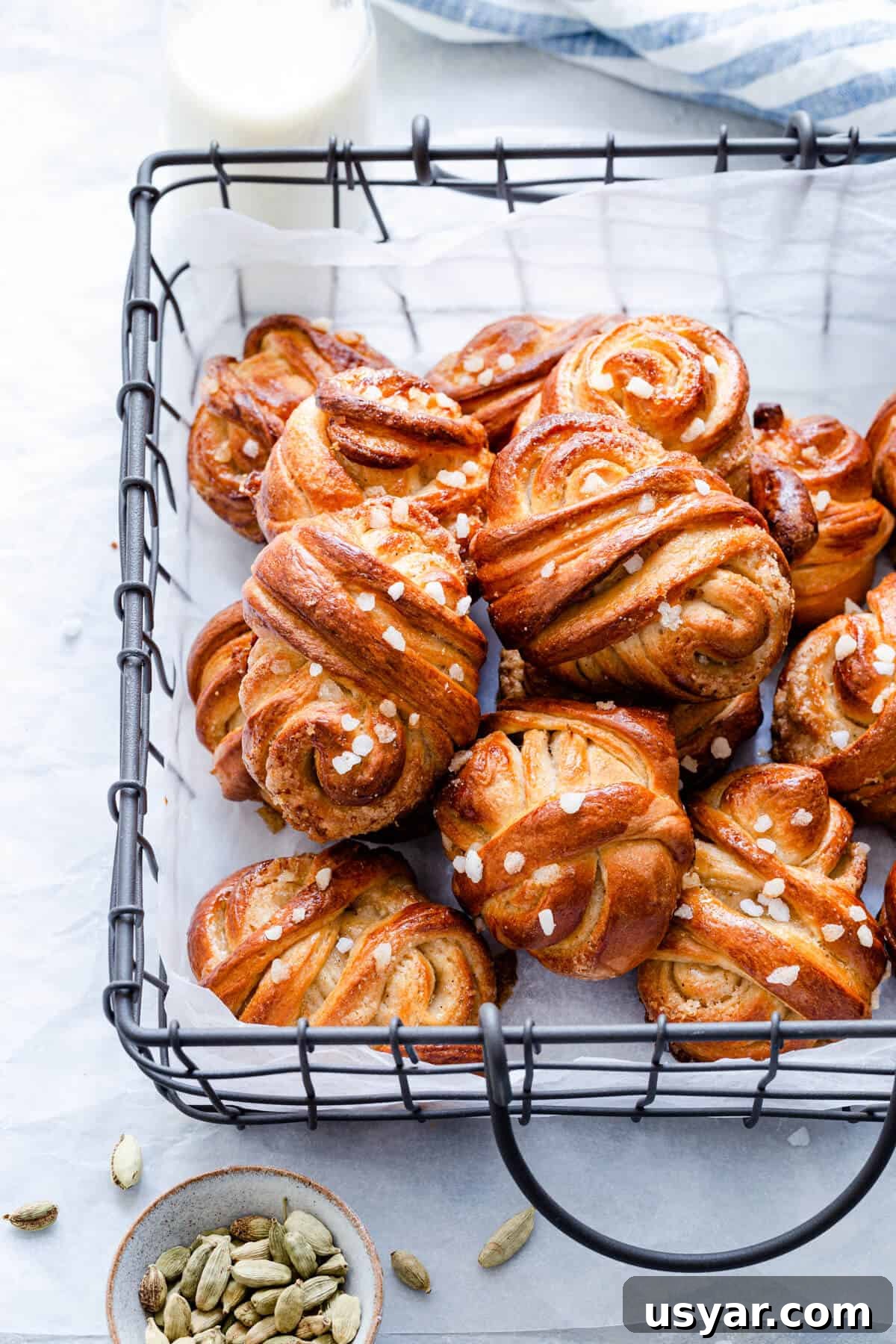 Swedish Cardamom Buns Recipe 19 side close up of cardamom buns in a wired basket