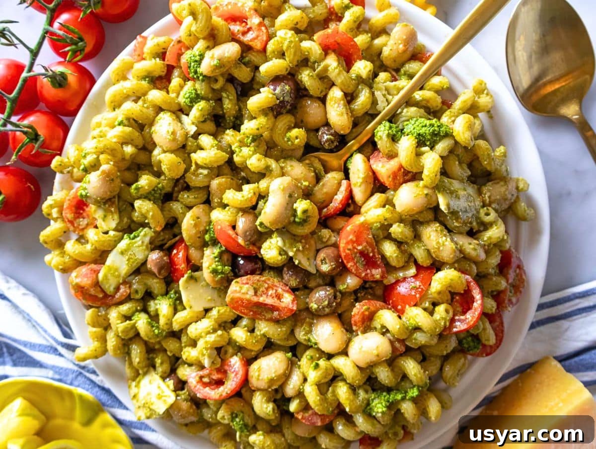 Pesto Pasta Salad with Marinated Butter Beans Recipe 8 Step 4 pesto pasta salad with marinated butter beans served on a white platter.