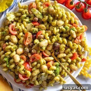 Pesto Pasta Salad with Marinated Butter Beans Recipe 9 Healthy pesto pasta salad with marinated butter beans served with shaved parmesan.