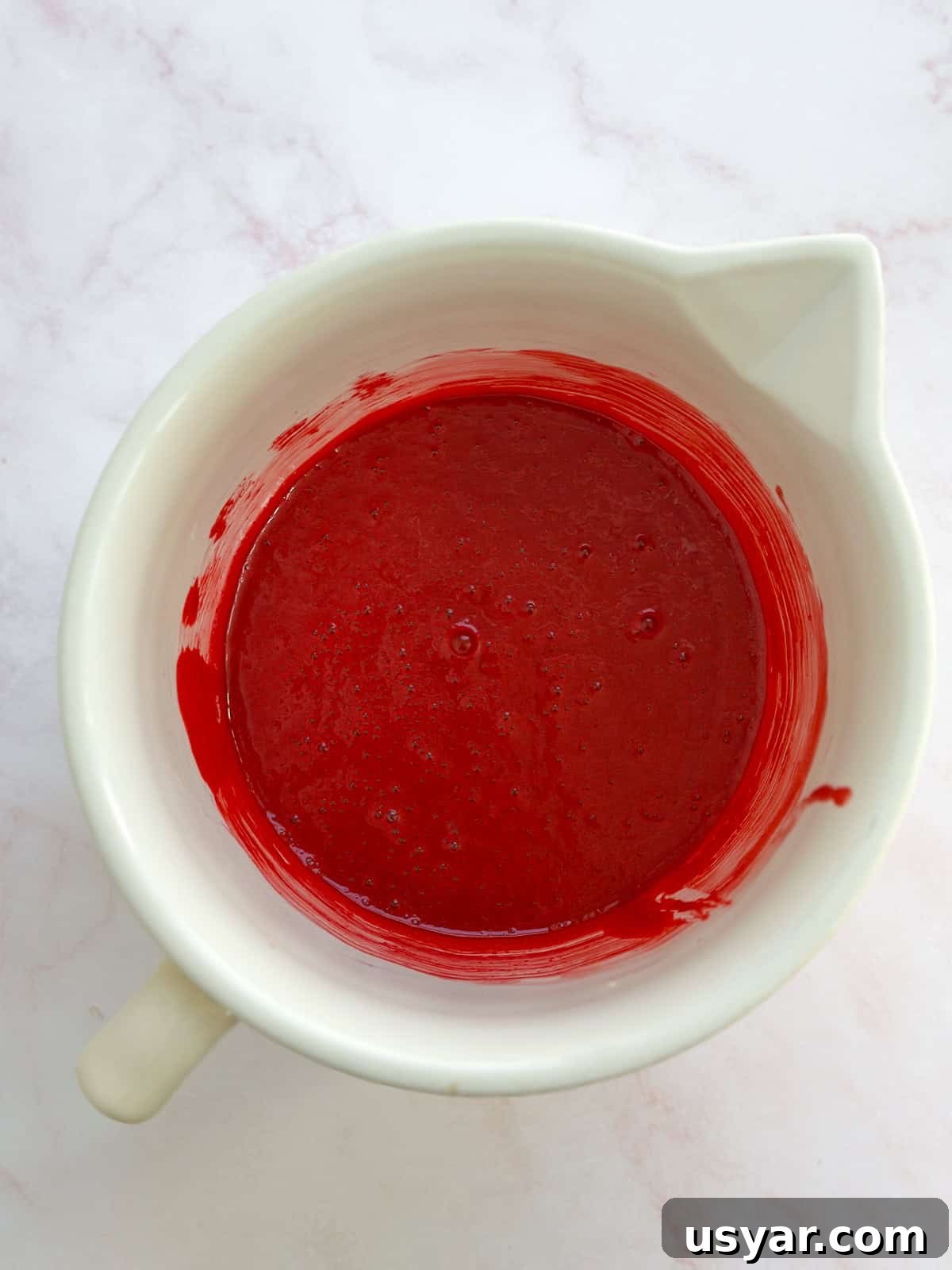 Mini Red Velvet Cake with Cream Cheese Frosting 5 wet ingredients mixed together.