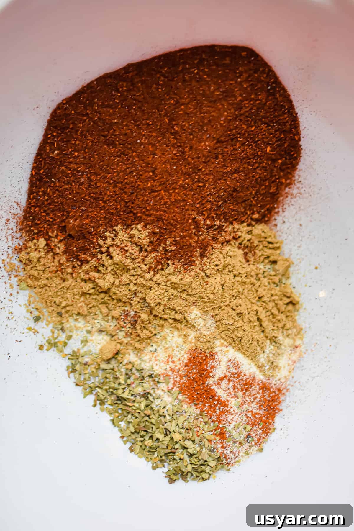 Spices combined in a bowl for taco seasoning