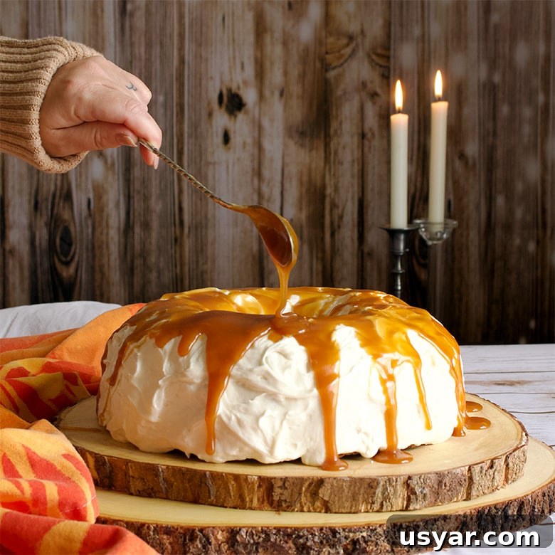 Join the October Baking Club Challenge and Win Prizes 6 Drizzling Salted Caramel Rum Sauce over Carrot Cake Bundt Cake with Cream Cheese Buttercream.
