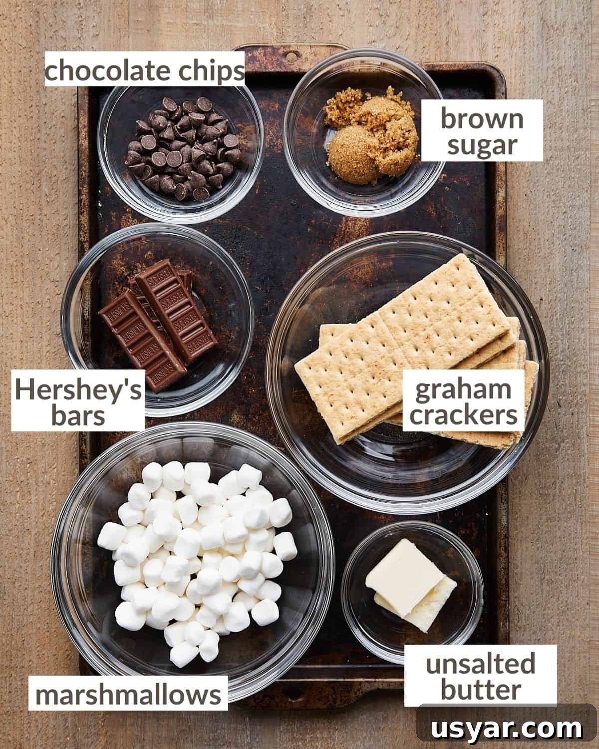 Mini S'mores Pies with Graham Cracker Crust Recipe 3 Overhead image of ingredients needed to make mini s'mores pies.