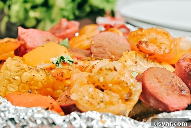 Cajun Shrimp Boil Foil Packets for Grill or Oven 3 close up of cajun shrimp with sausage and veggies