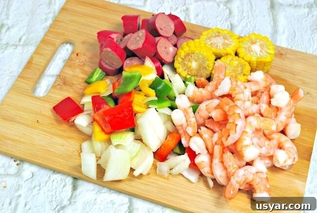 Cajun Shrimp Boil Foil Packets for Grill or Oven 5 Chopped onions and peppers and shrimp on cutting board