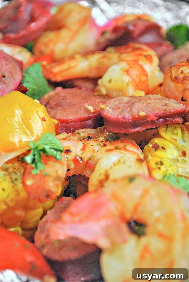 Cajun Shrimp Boil Foil Packets for Grill or Oven 8 close up of cajun shrimp boil in foil