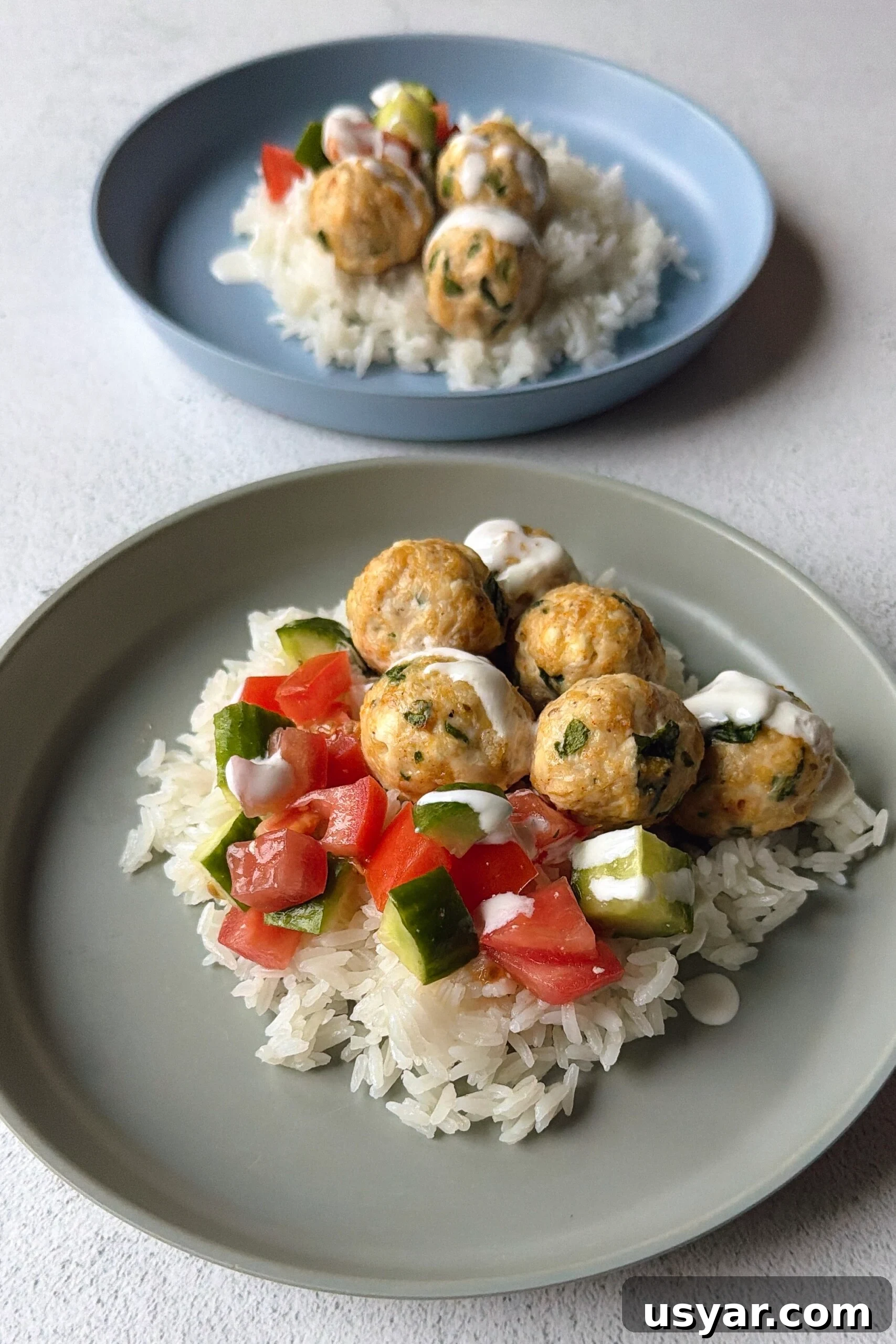 Chicken feta meatballs served over rice.