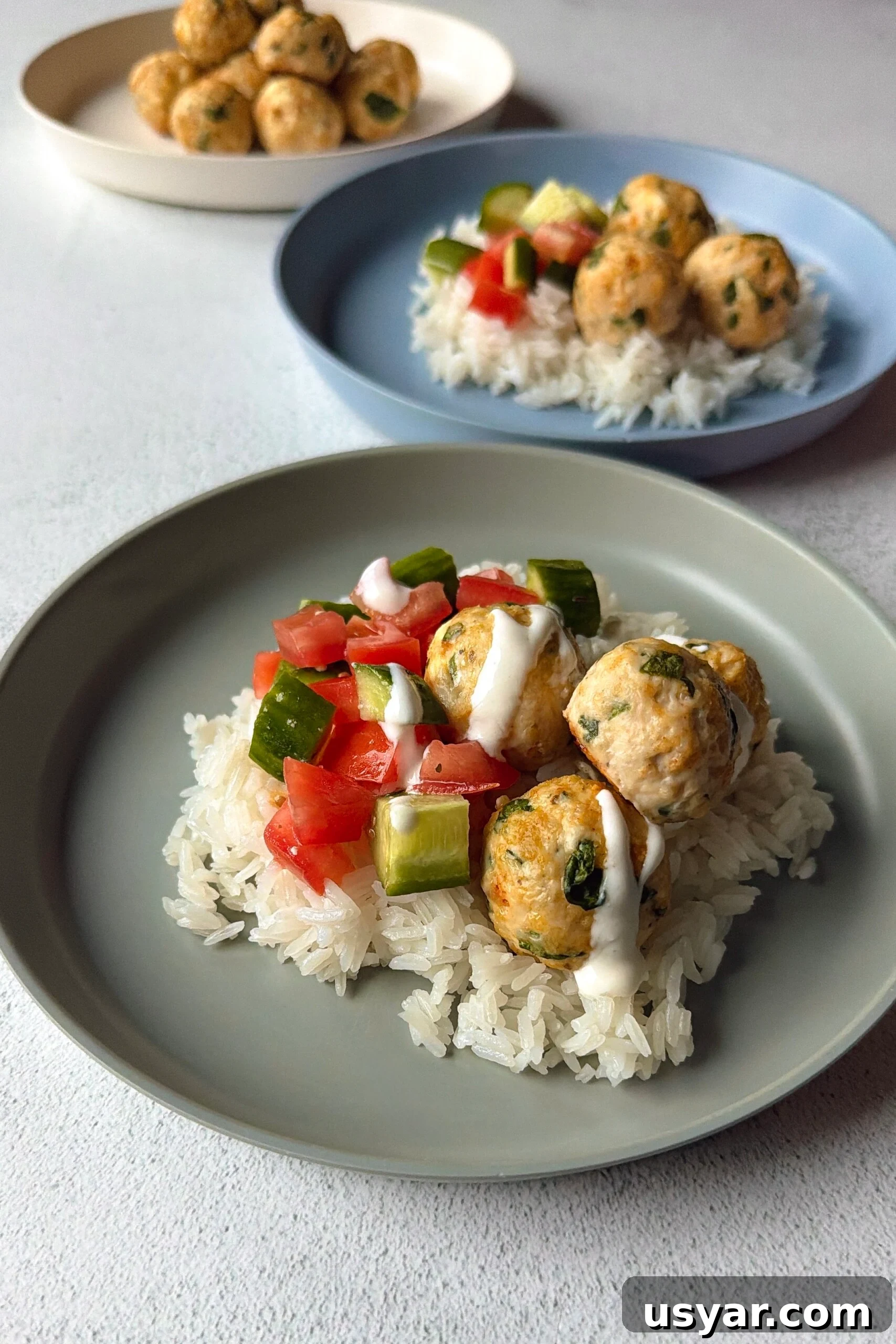 Chicken feta meatballs served over rice.