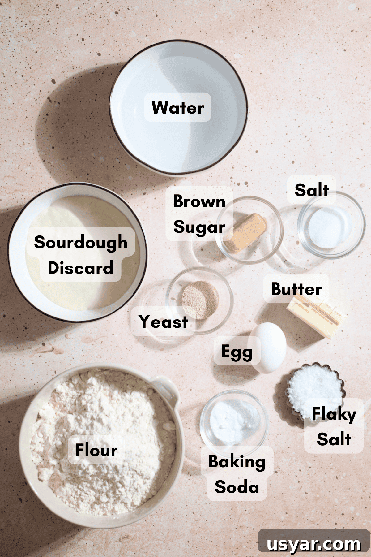 Ingredients for a Sourdough Discard Jumbo Pretzel in small bowls.