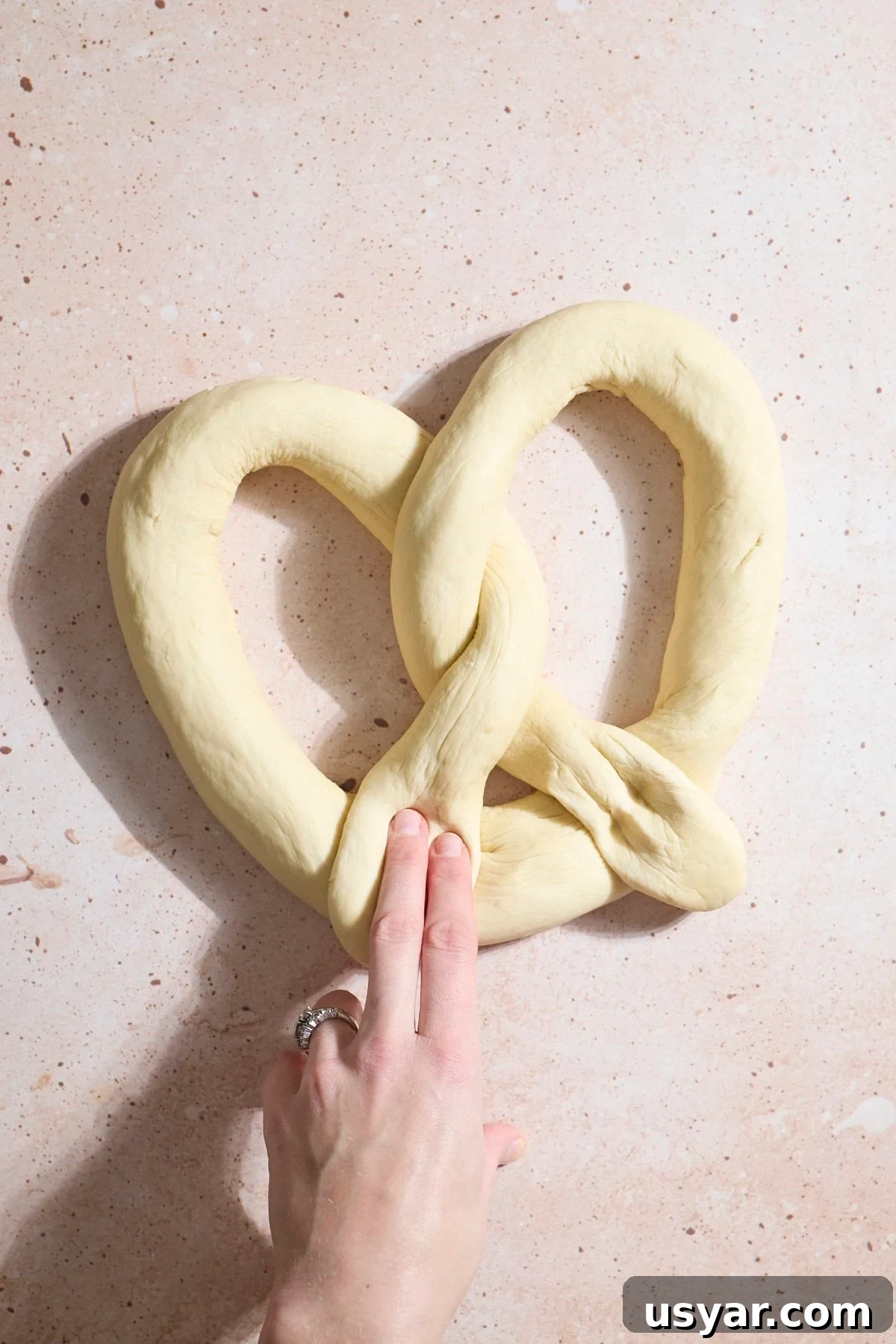 Dough shaped into a pretzel.