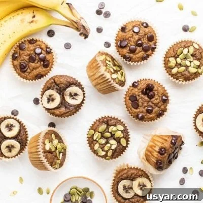 Moist Gluten-Free Banana Muffins Recipe 7 Banana Muffins topped with chocolate chips, pumpkin seeds, and banana slices.