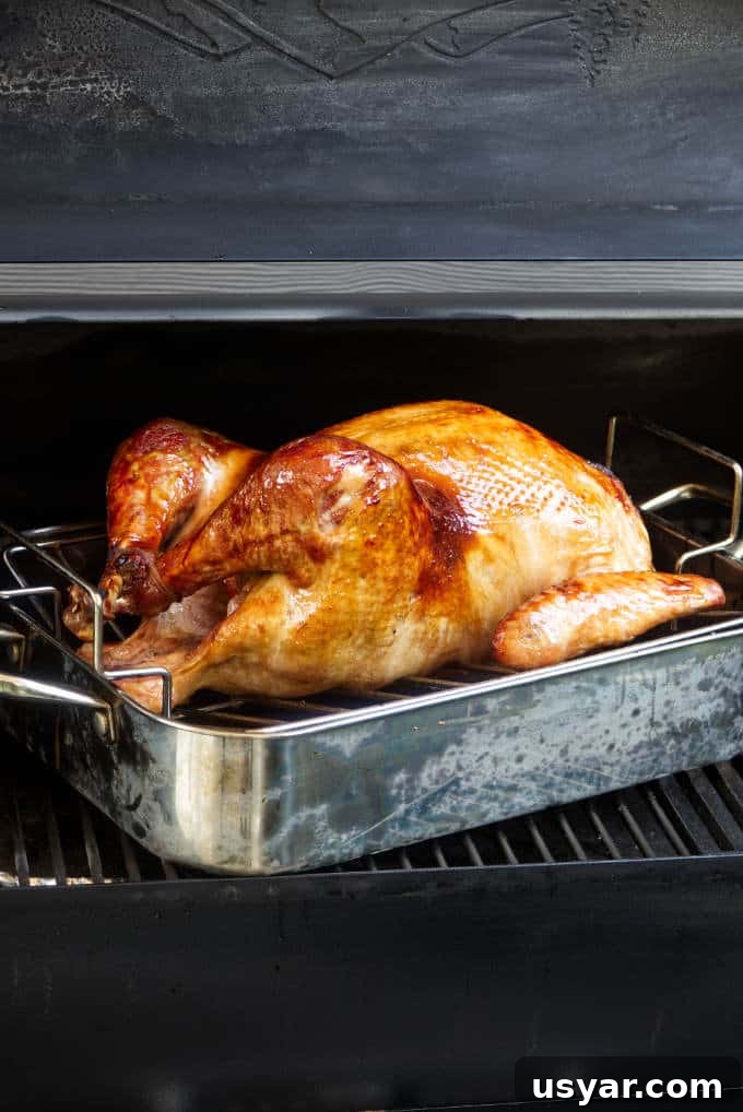 Bourbon brined and glazed turkey on a Traeger grill.