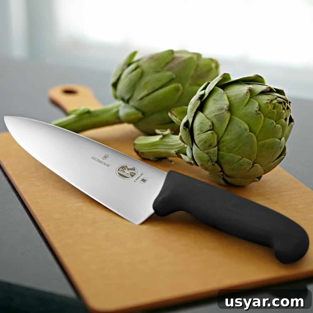 10 Time-Saving Kitchen Tools for Busy Moms 5 Chef knife and cutting board with vegetables