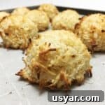 Coconut Macaroons: Congolais vs Rochers Coco 12 A baked batch of macaroons on a baking sheet lined with parchment paper.