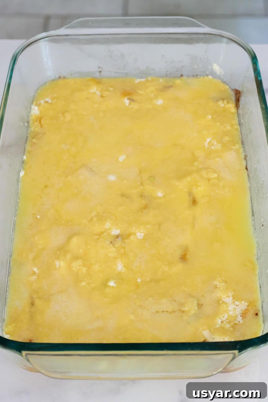 Cake Mix Peach Cobbler with Canned Peaches 7 Melted butter spread over the cake mix in a baking dish.