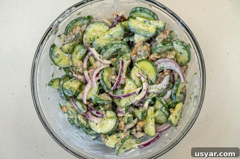 Creamy Cucumber Mint Yogurt Salad - No Dill 6 Tossing the salad together