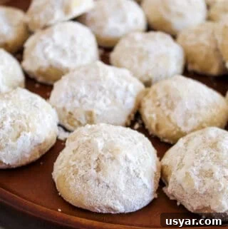 Gluten-Free Mexican Wedding Cookies: Almond Snowball Recipe 4 mexican wedding cookies on a platter.