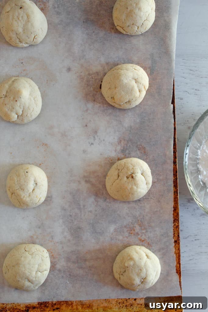 Gluten-Free Mexican Wedding Cookies: Almond Snowball Recipe 6 pan of cookies on a baking sheet.