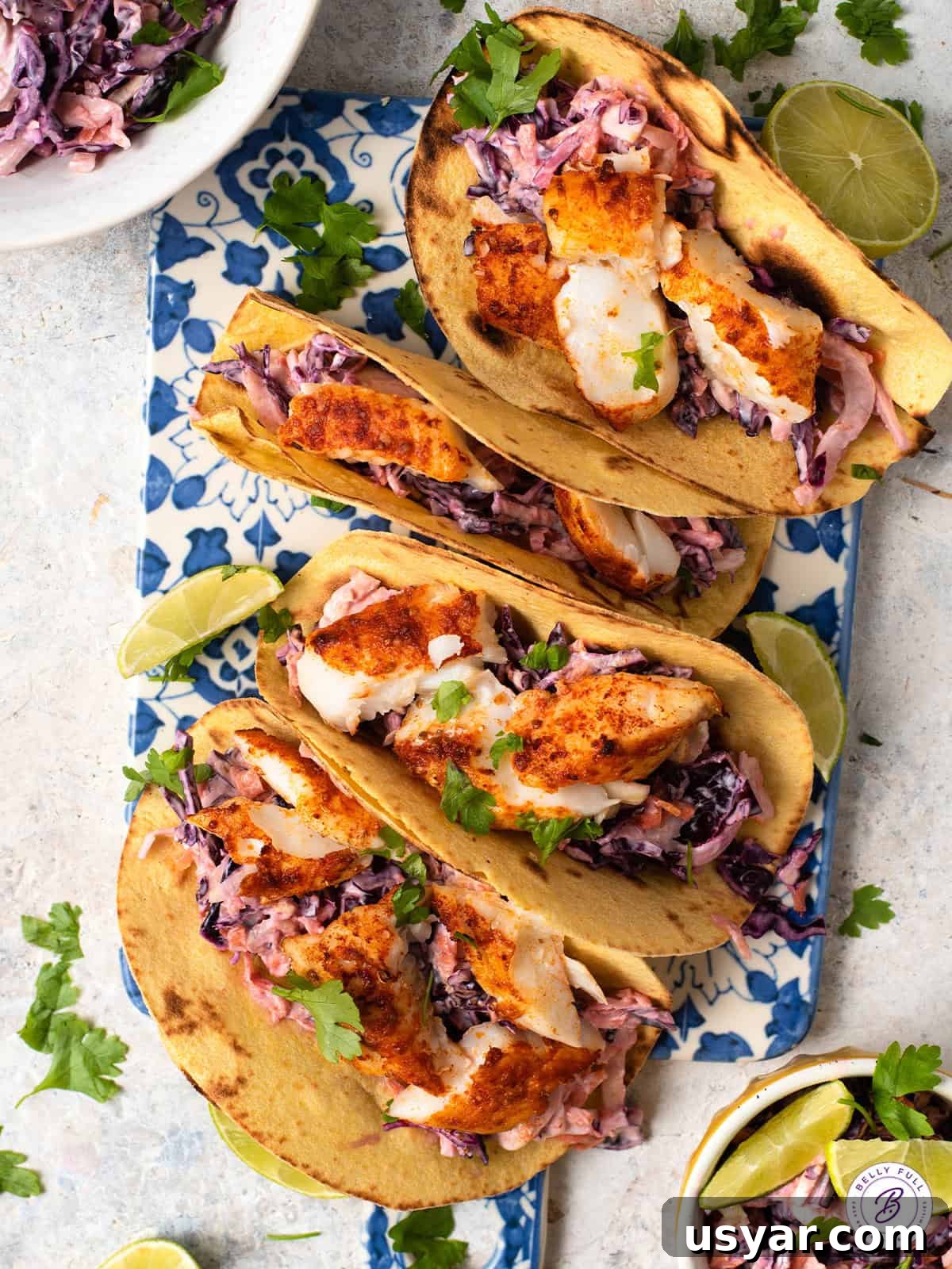 Grilled Fish Tacos Recipe with Cilantro Lime Slaw 2 4 fish tacos on plate