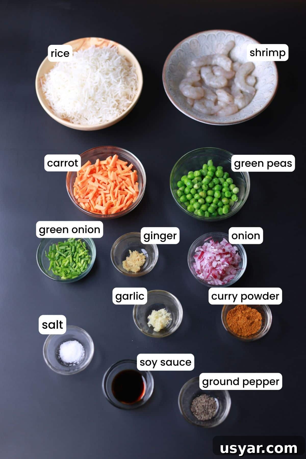 Quick Shrimp Curry Fried Rice Recipe 3 Curry fried rice ingredients are placed on a black background.