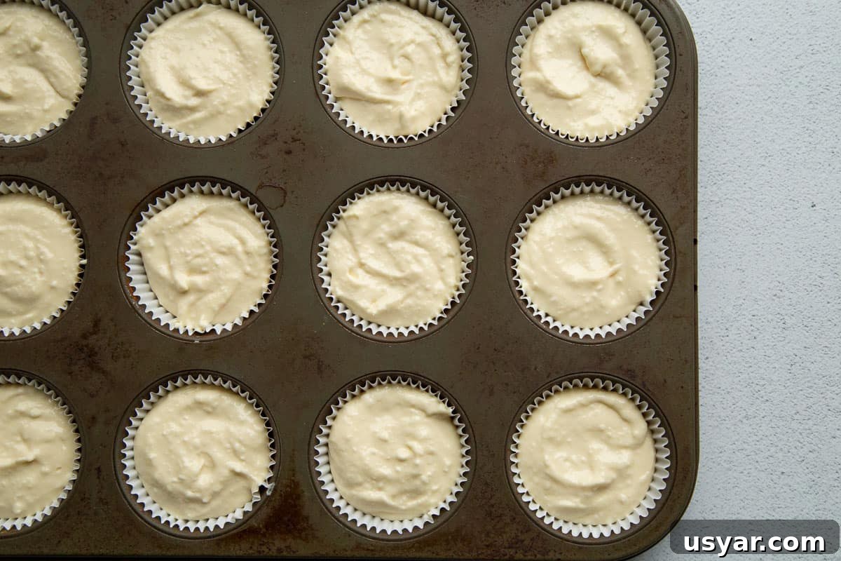 Mini Cherry Cheesecakes with Graham Cracker Crust 6 cream cheese mixture in cupcake liners in a 12-cup muffin tin.