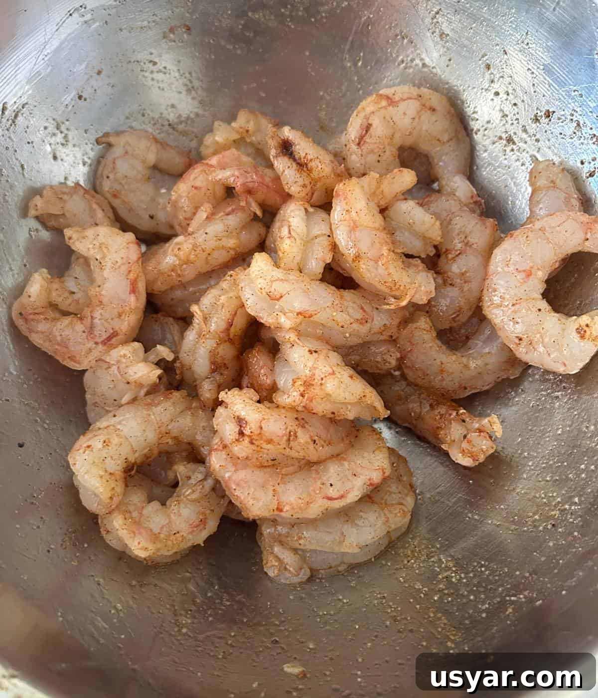 Garlic Butter Shrimp on a Blackstone Griddle 4 Peeled and deveined shrimp in marinade.