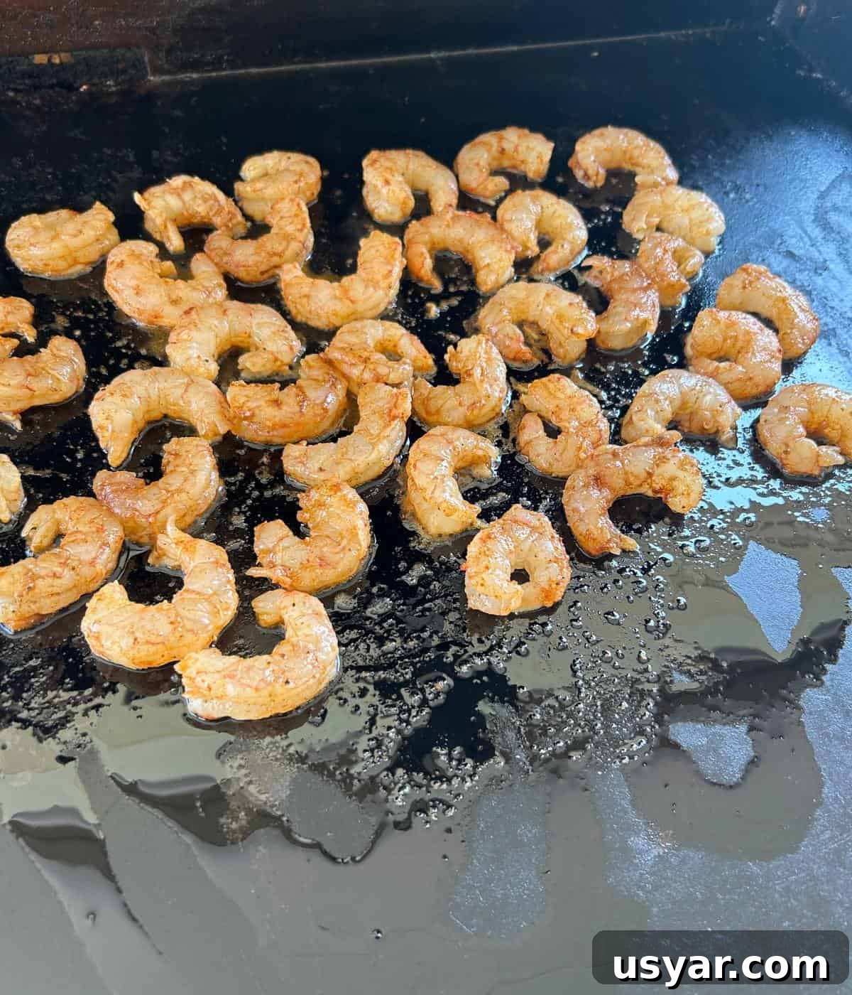 Garlic Butter Shrimp on a Blackstone Griddle 5 Cooking shrimp on the griddle.