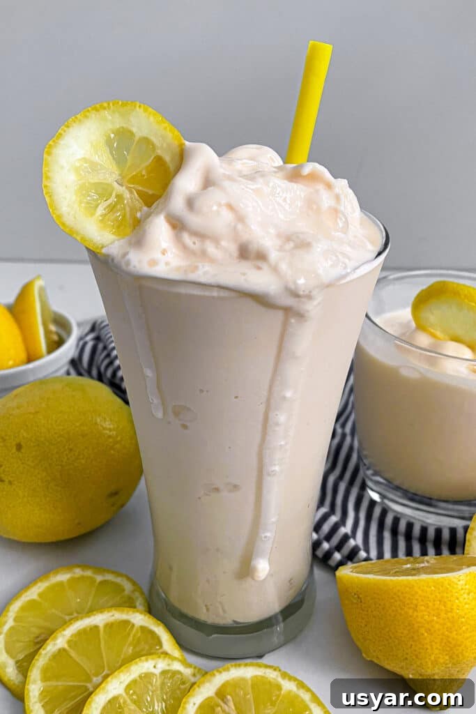 Homemade Chick-fil-A Frosted Lemonade Copycat Recipe 2 Copycat Chick-fil-A Frosted Lemonade in a serving glass with lemons