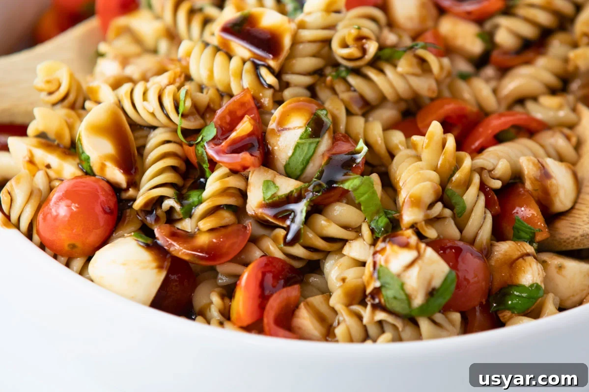 Caprese Pasta Salad with Fresh Mozzarella and Basil 4 caprese pasta salad with tomatoes, mozzarella cheese, balsamic vinaigrette dressing