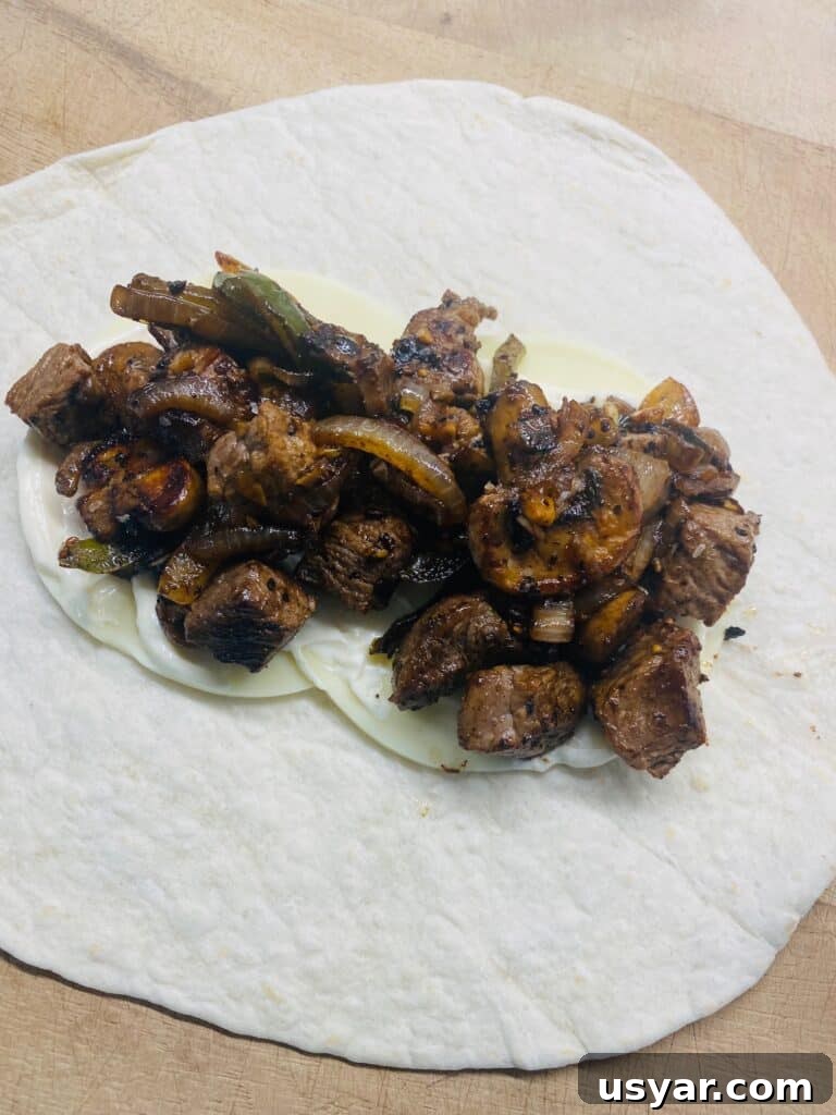 Philly Cheesesteak Burrito Recipe for Blackstone Griddle 8 burrito before rolling