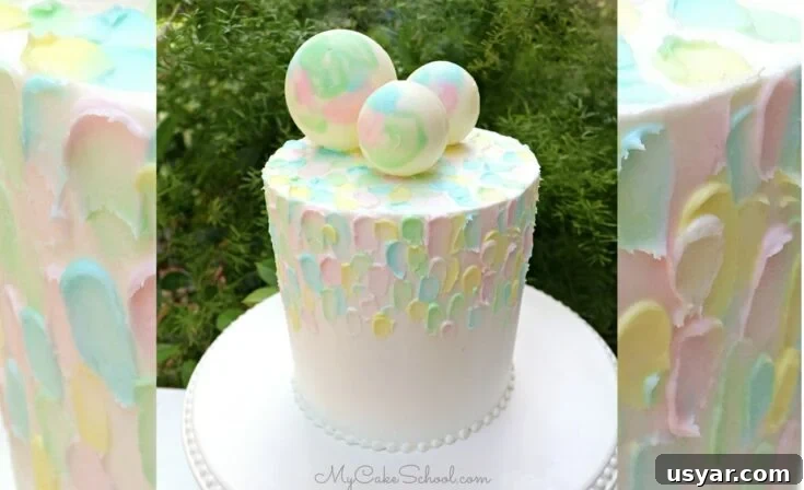 Painted buttercream cake with chocolate spheres