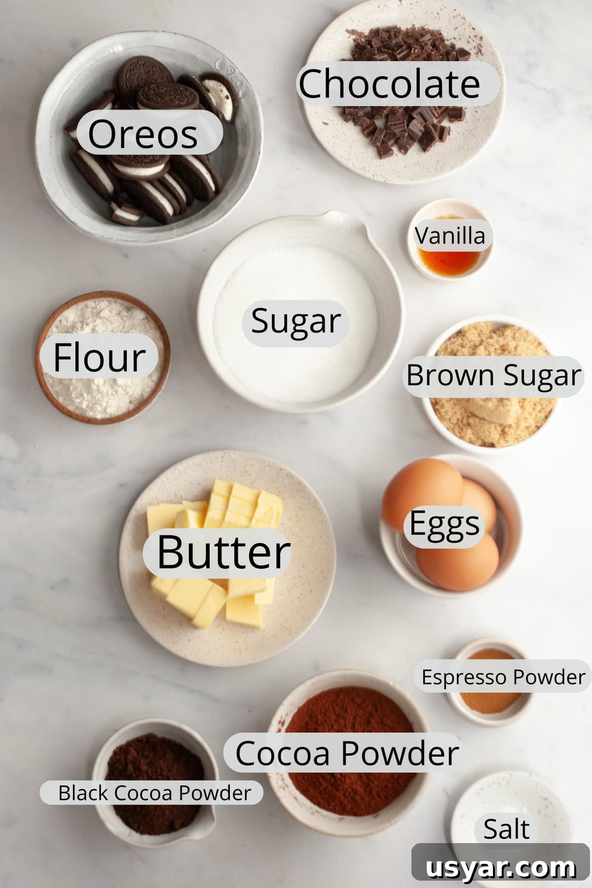 All the ingredients needed to make Oreo brownies, weighed out into small bowls.