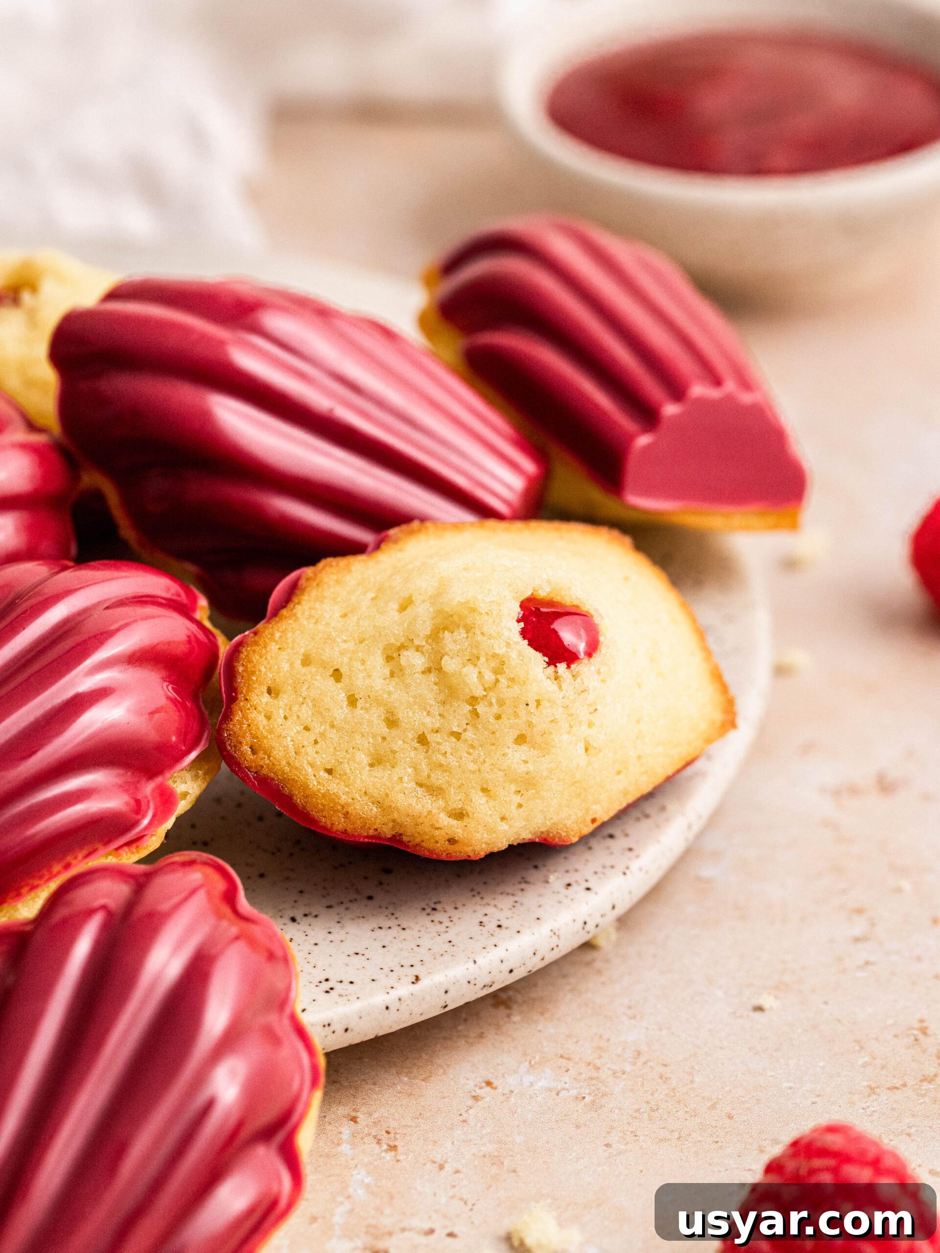 Raspberry madeleines on a plate.