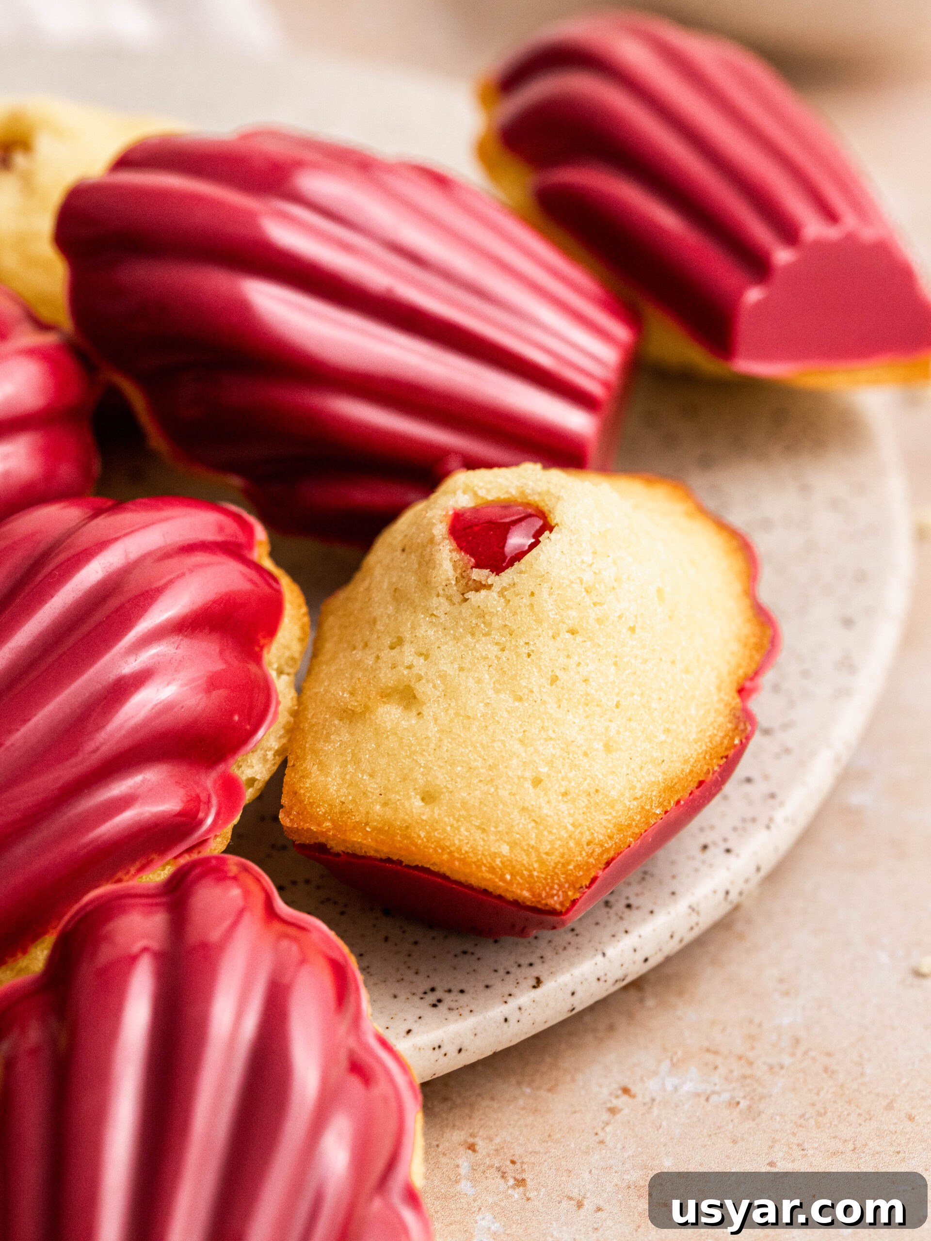 raspberry madeleines on a plate.