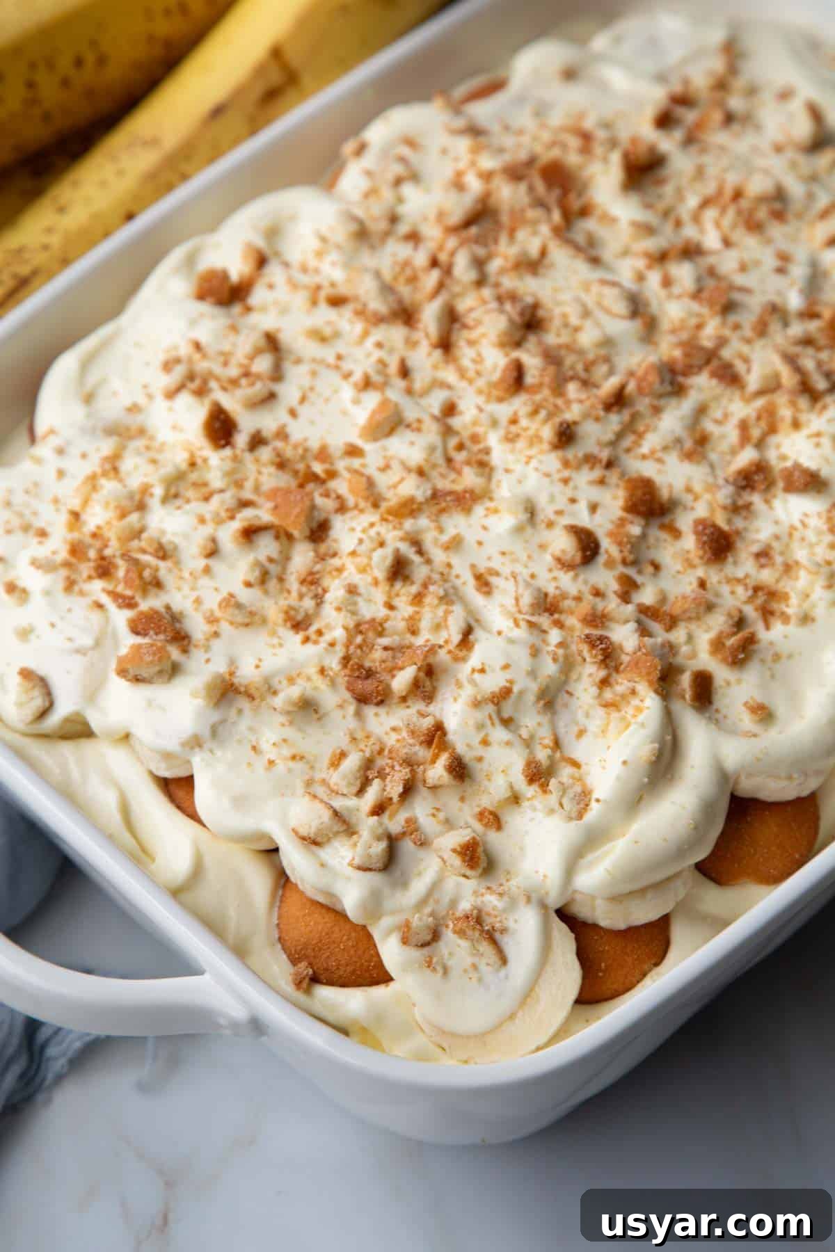 Creamy Banana Pudding Recipe with Sour Cream 2 the top of no cook banana pudding in a white baking dish.