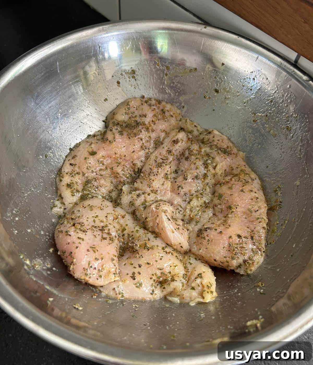 Creamy Chicken Caesar Pasta Salad Recipe 4 Grilled chicken marinating in bowl.