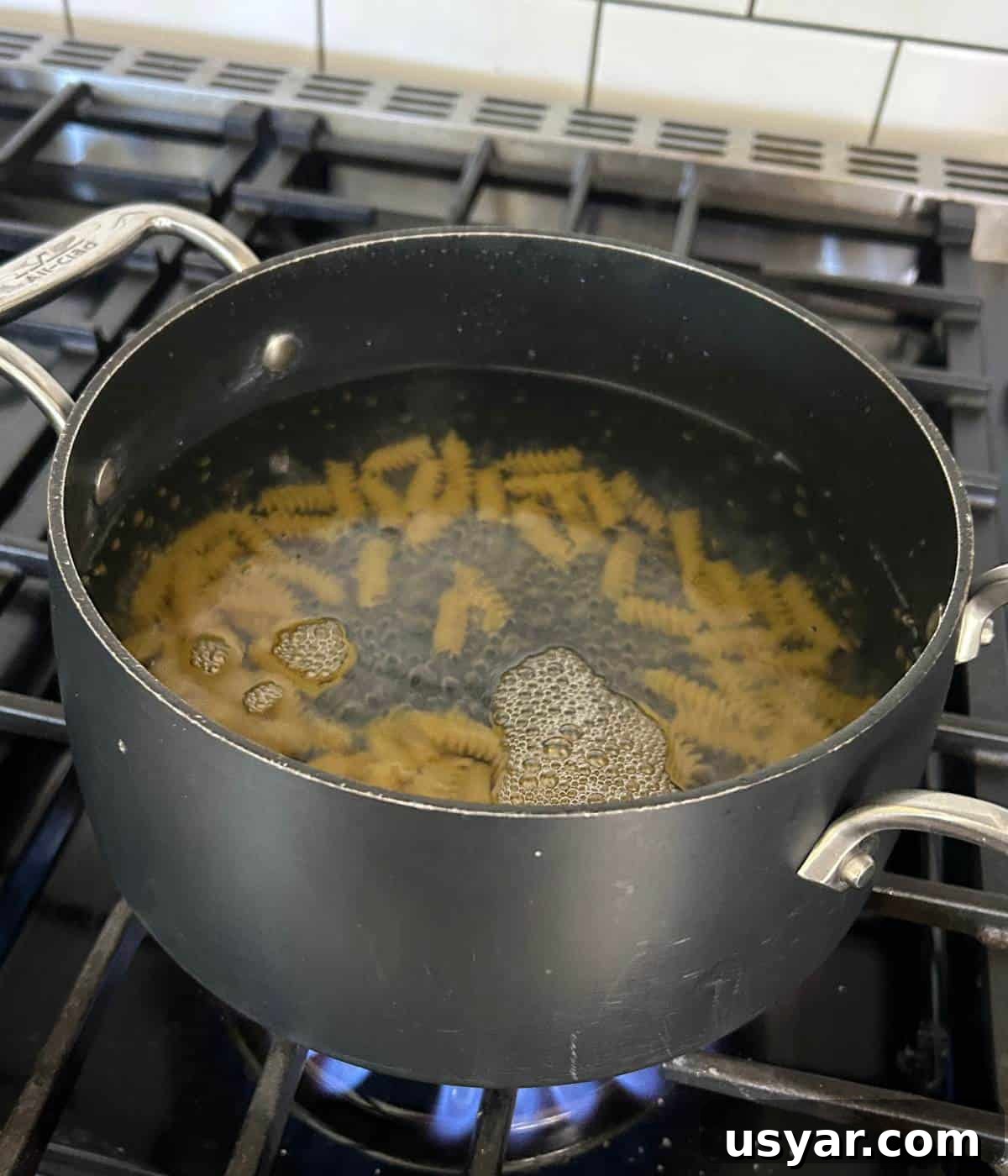 Creamy Chicken Caesar Pasta Salad Recipe 7 Boiling pasta in pot.