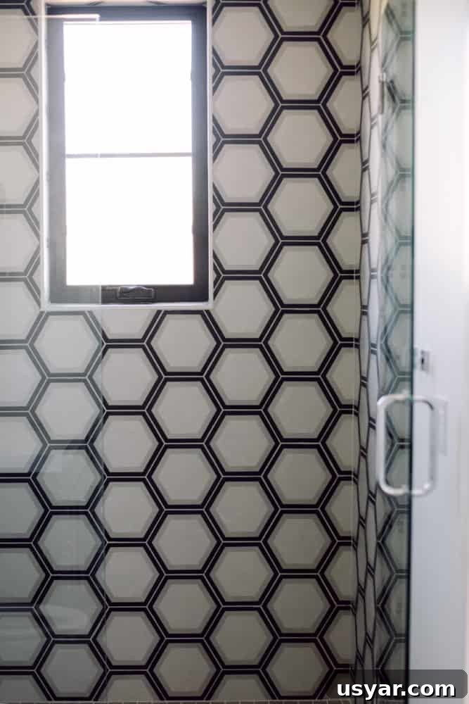 Shower with Grey and Black Pattern Wall Tile